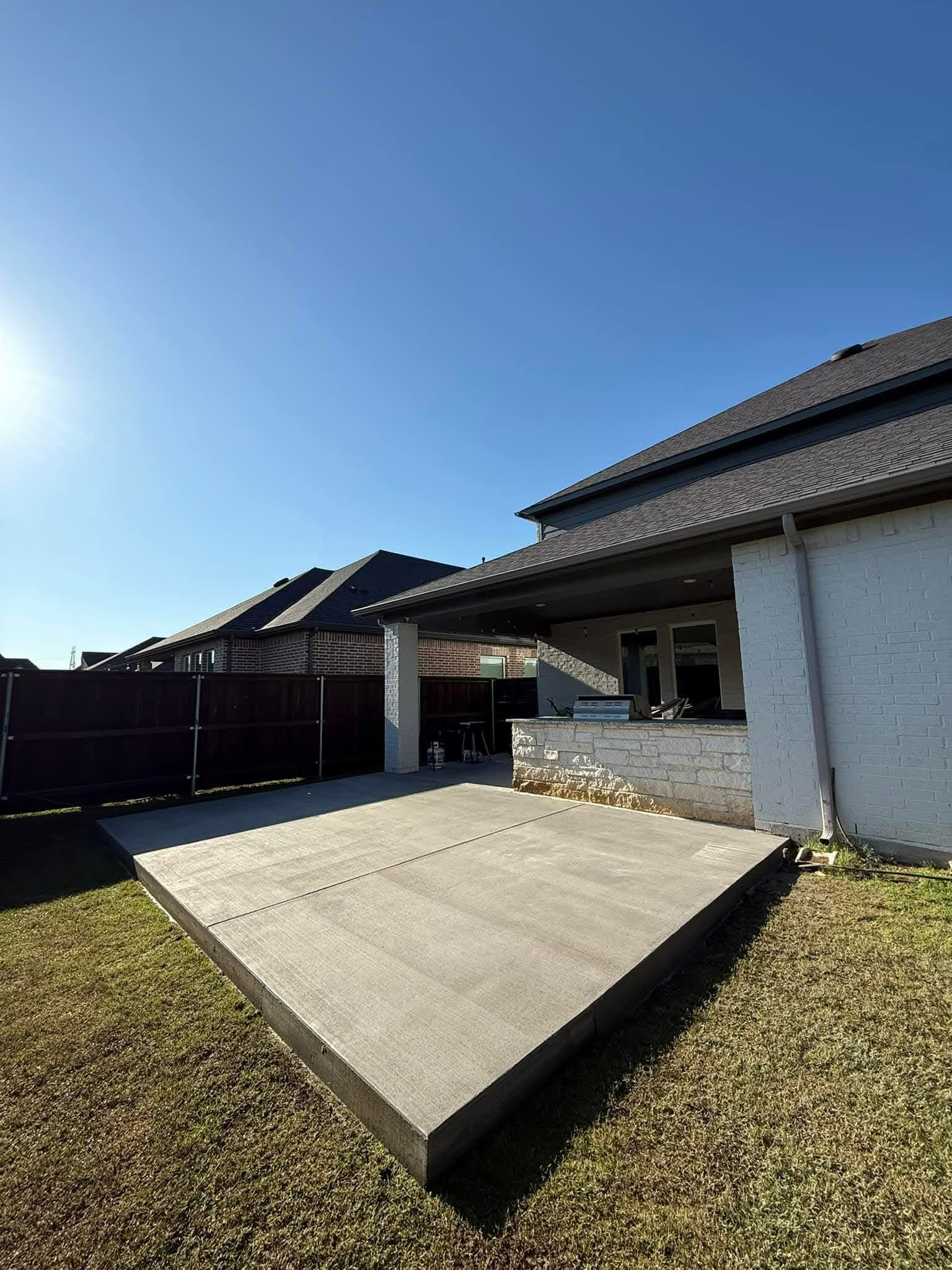 Newly poured concrete patio at a residential home