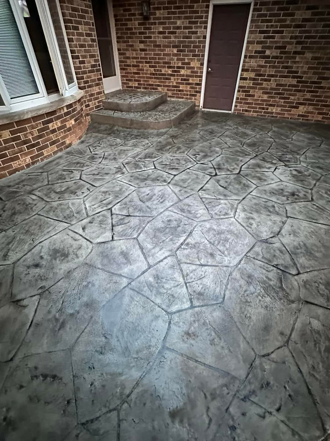 Stamped concrete patio with flagstone pattern